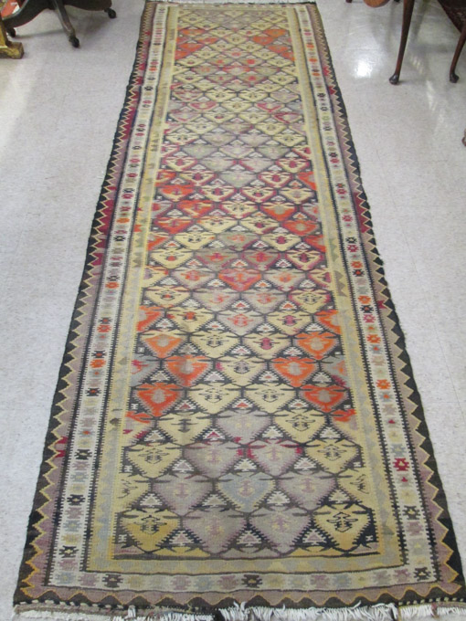 Appraisal: TRIBAL KILIM FLATWEAVE LONG RUG hand woven ' x '