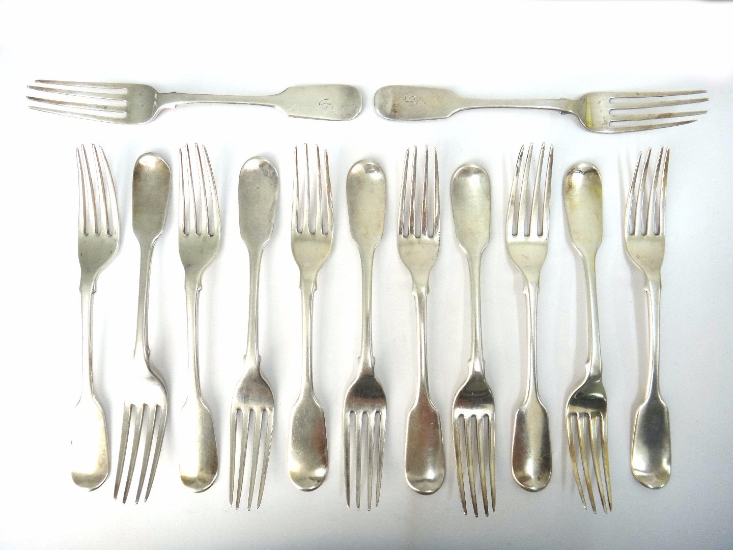 Appraisal: A set of eleven Victorian silver fiddle pattern dessert forks