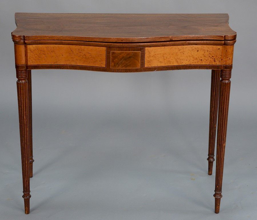 Appraisal: Sheraton mahogany game table having serpentine top with birdseye maple