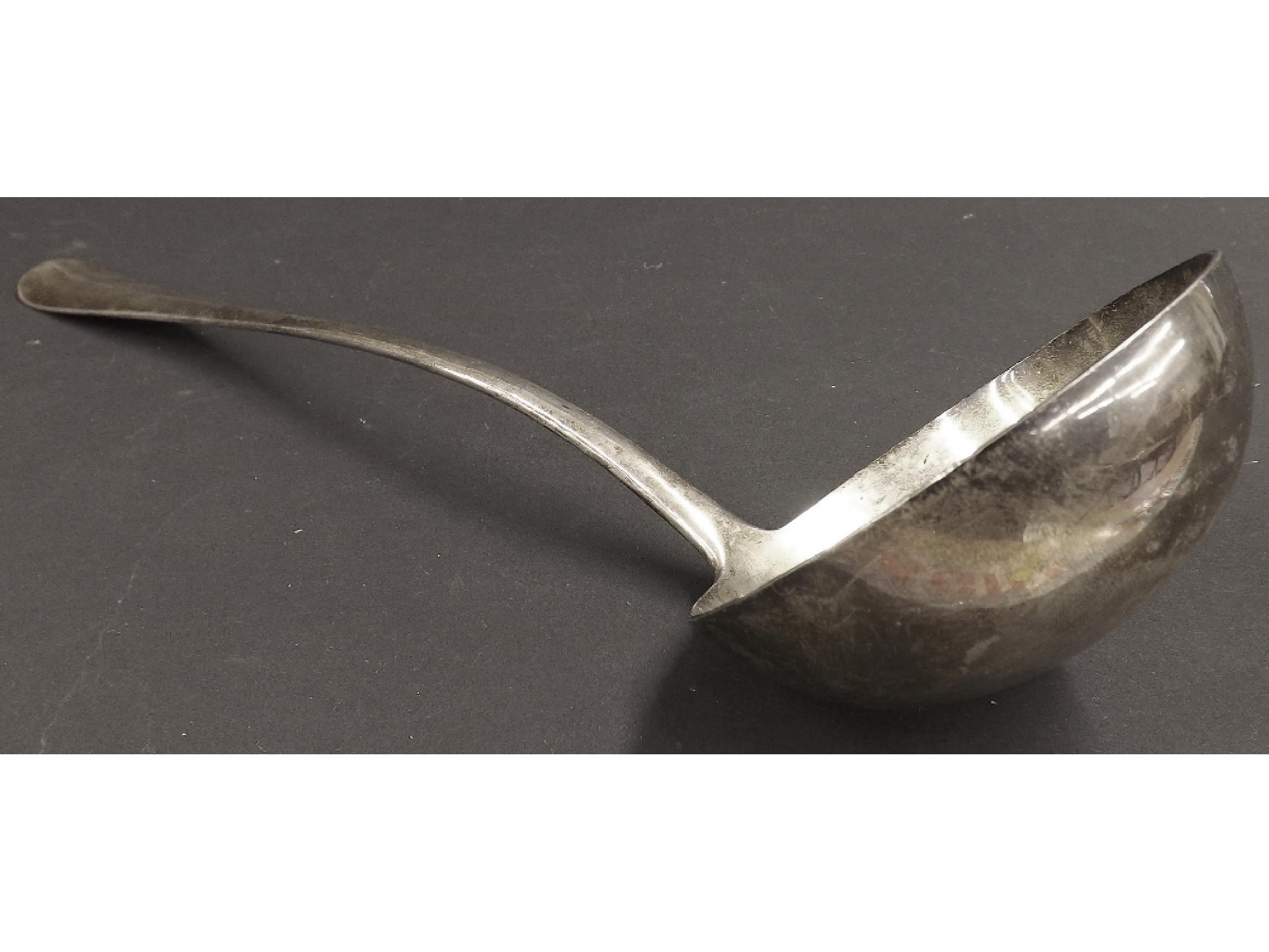 Appraisal: Edwardian silver Old English rat tail soup ladle maker Goldsmith