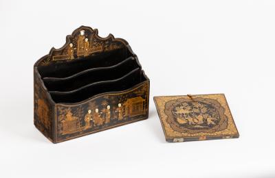 Appraisal: An Edwardian chinoiserie three section stationery rack the black and