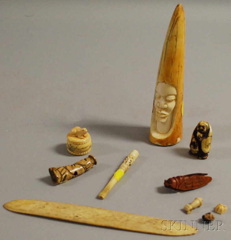 Appraisal: Nine Assorted Carved Ivory and Wood Items an African carved