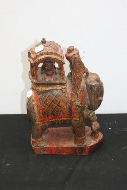 Appraisal: A polychrome Dikpal figure the howdah containing two seated figures