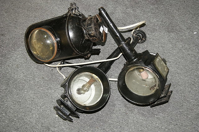 Appraisal: A pair of Victorian carriage lampsand an old railway lamp