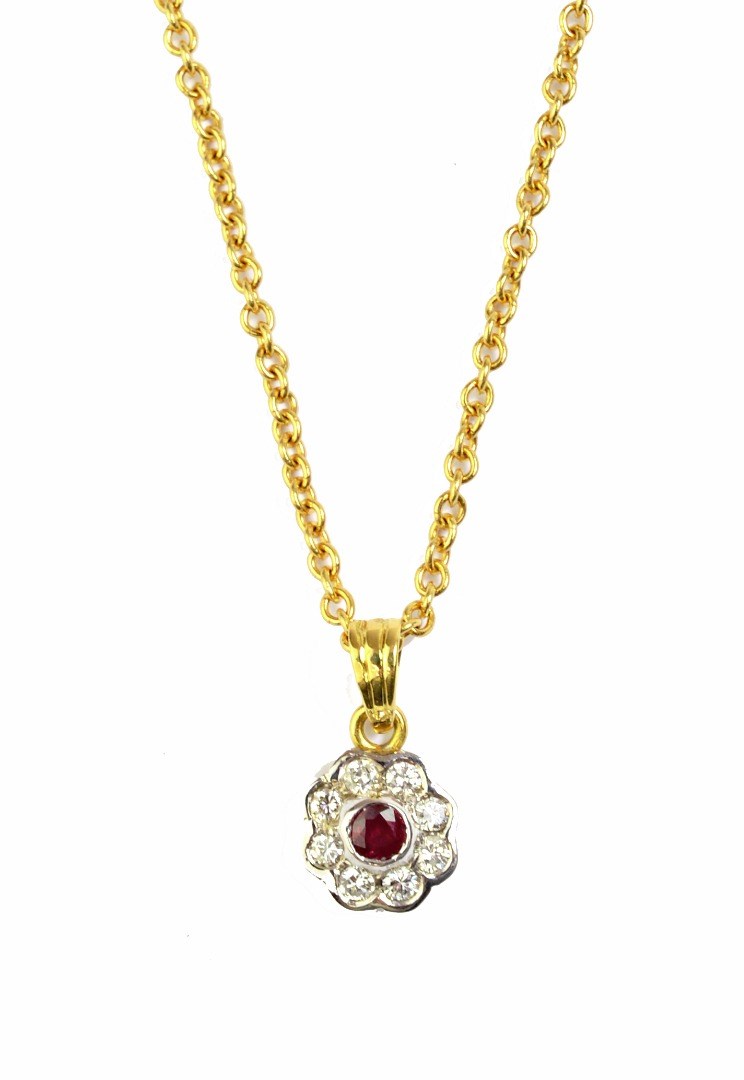 Appraisal: An ct gold ruby and diamond set nine stone cluster