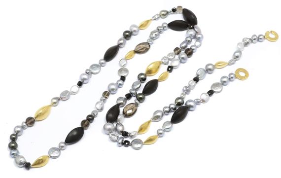 Appraisal: A PEARL EBONY AND GEMSTONE SAUTOIR Gilded silver clasp and