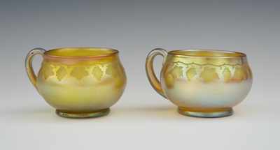 Appraisal: Two Signed Tiffany Gold Favrile Cups Two gold favrile glass