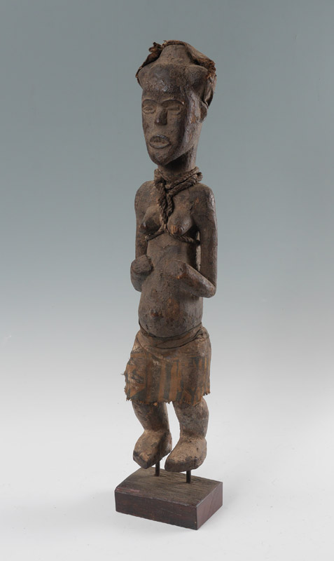 Appraisal: YORUBA CARVED AFRICAN FIGURE Standing female figure with applied leather