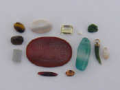 Appraisal: A bag of loose stones including a carnelian tablet etched