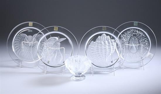 Appraisal: FOUR LALIQUE CLEAR AND FROSTED GLASS ANNUAL PLATES AND FOOTED