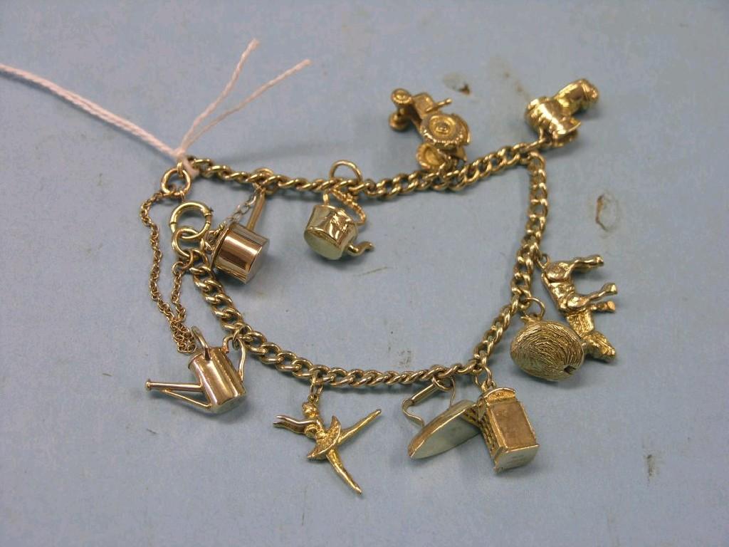 Appraisal: A ct gold charm bracelet ten ct gold charms grams