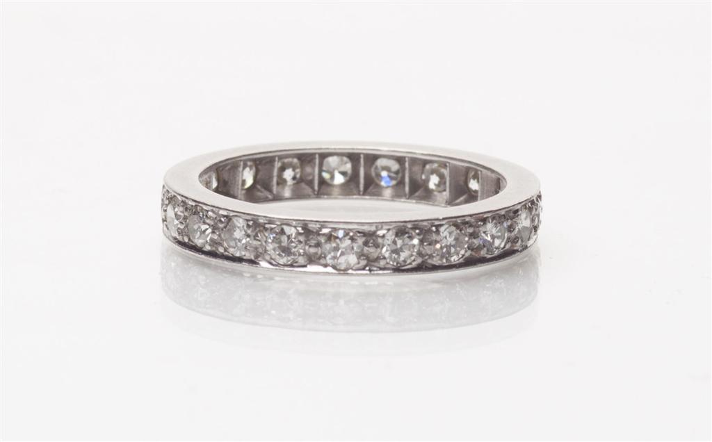 Appraisal: A diamond set eternity ring set throughout in white metal