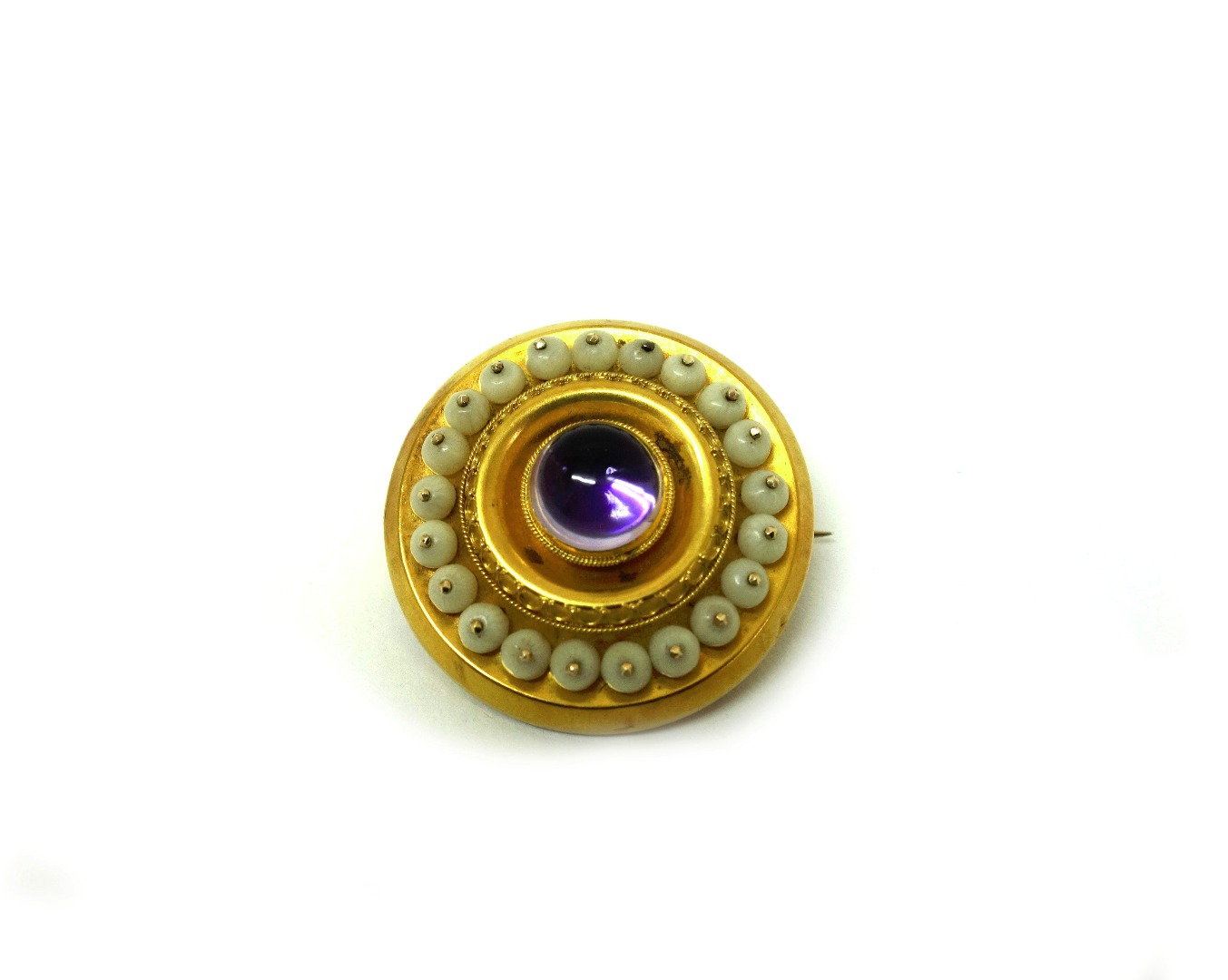 Appraisal: A Victorian gold cabochon amethyst and ivory bead circular brooch