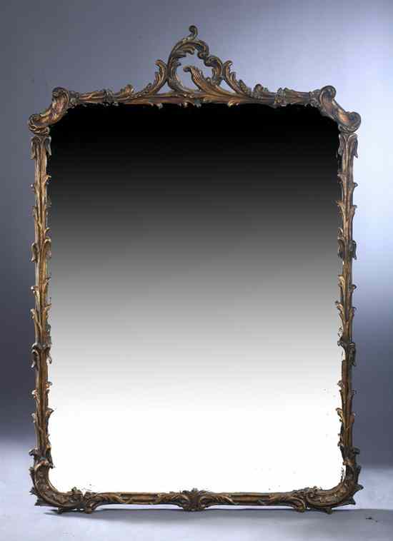 Appraisal: LOUIS XV STYLE GILT-COMPOSITION WALL MIRROR Foliate swag encompassing plate