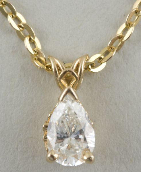 Appraisal: KT Yellow Gold and Diamond Pendant Chain with solitaire pear