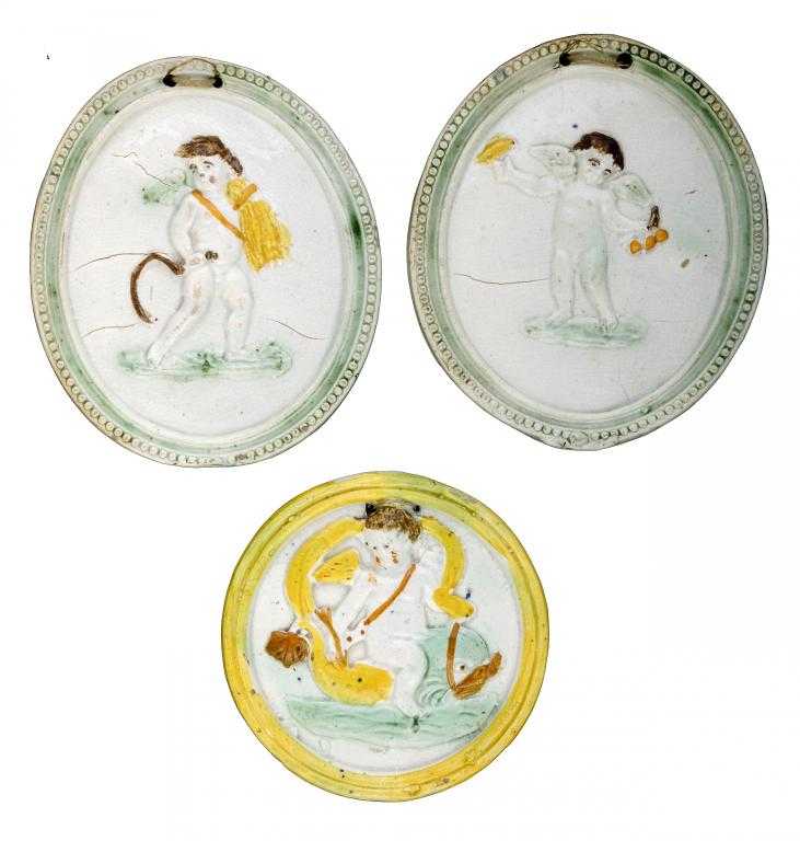 Appraisal: ONE AND A PAIR OF CREAMWARE PLAQUES press-moulded with Seasons