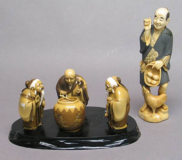 Appraisal: A group of Japanese tinted ivory figures The first a