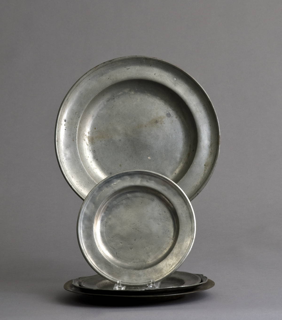 Appraisal: FIVE PEWTER PLATES INCLUDING TWO BY MEMBERS OF THE DANFORTH