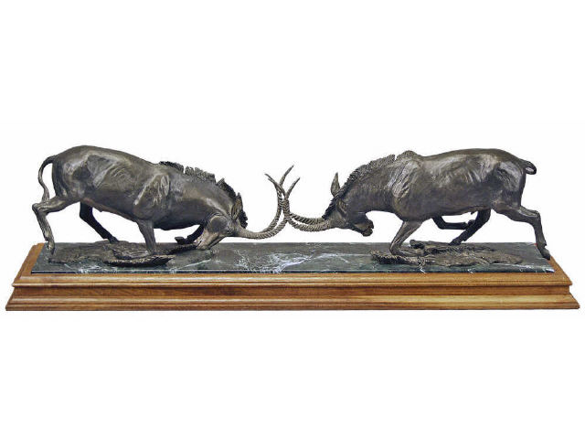 Appraisal: Fighting Ibex bronze on walnut marble base by noted Wild