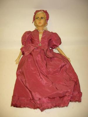 Appraisal: A 's boudoir doll with moulded fabric head painted face