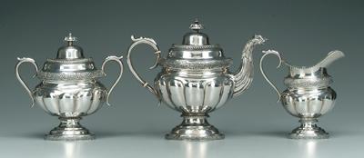 Appraisal: Three-piece coin silver tea service in teapot creamer lidded sugar