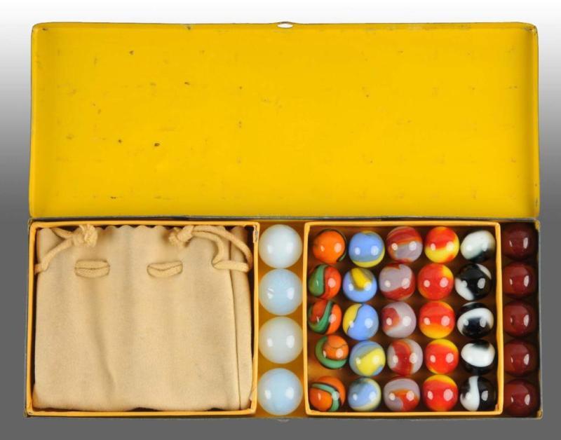 Appraisal: Akro Tin Boxed Marble Set Description Includes original two-colored corkscrews