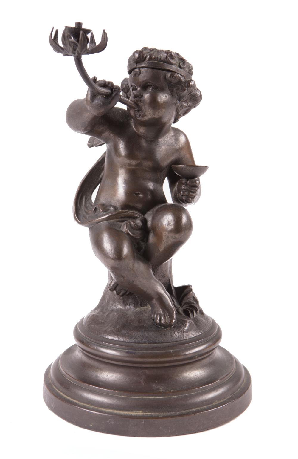 Appraisal: Continental Patinated Bronze Figural Lighter c lidded cherub head opens