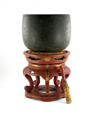 Appraisal: A Chinese U-shaped temple gong raised on a red lacquer