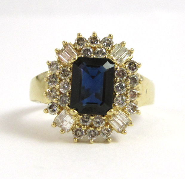 Appraisal: SAPPHIRE DIAMOND AND FOURTEEN KARAT GOLD RING with round-cut and