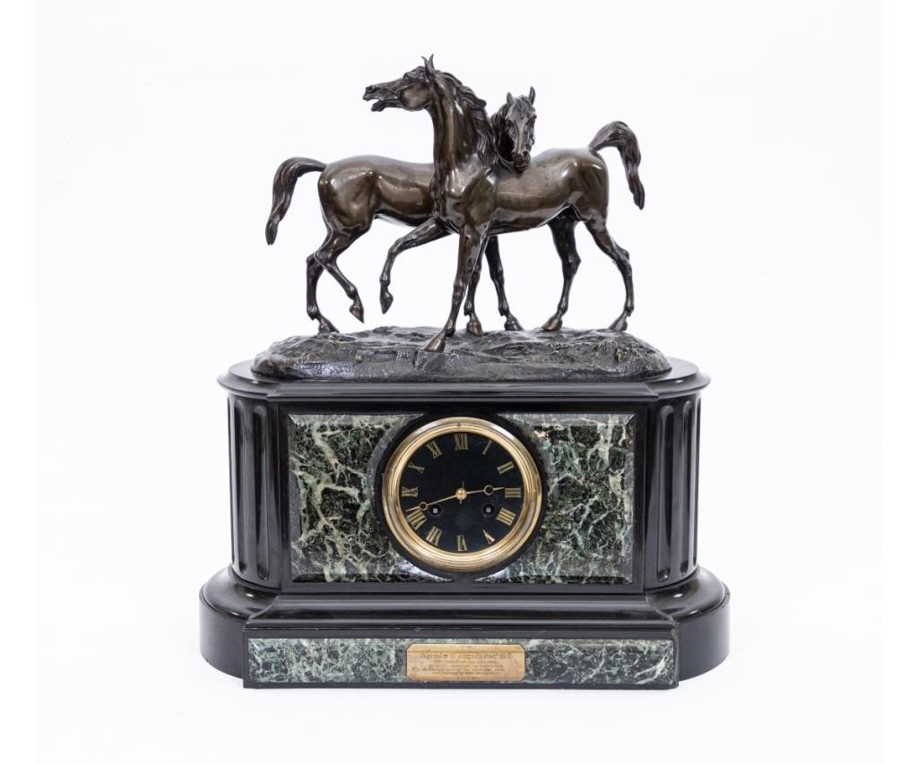 Appraisal: French black marble clock with equestrian bronze figural group with