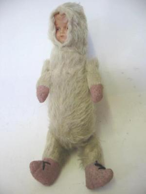 Appraisal: An Eskimo soft doll with moulded celluloid face cream plush