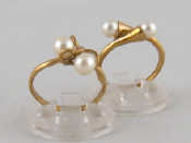 Appraisal: Two carat gold cultured pearl crossover rings both size O