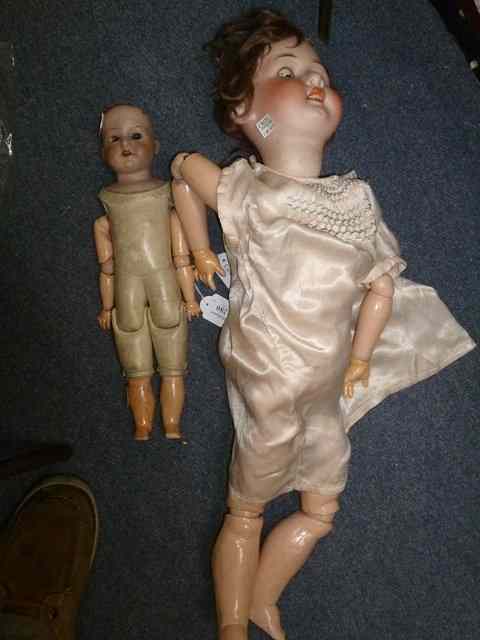 Appraisal: AN ARMAND MARSEILLE BISQUE HEADED DOLL with kid leather torso