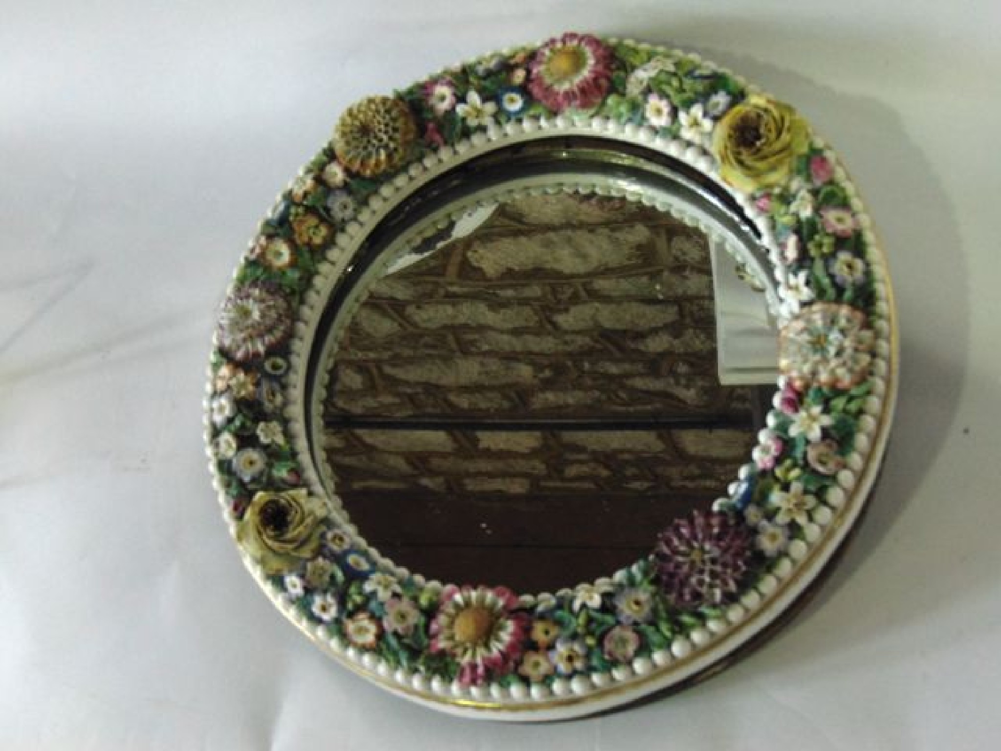 Appraisal: A th century continental mirror frame of circular form with