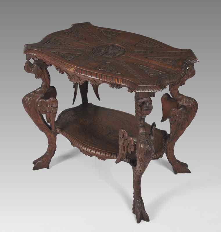 Appraisal: TH CENTURY CARVED WINGED GRIFFON TABLE This walnut table has