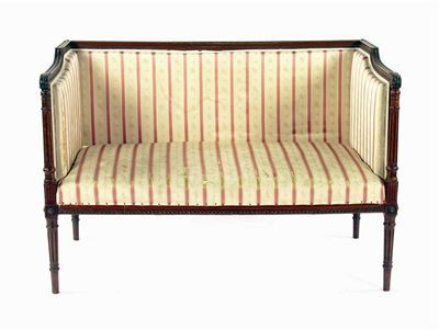 Appraisal: An Edwardian mahogany two seater settee with carved and turned