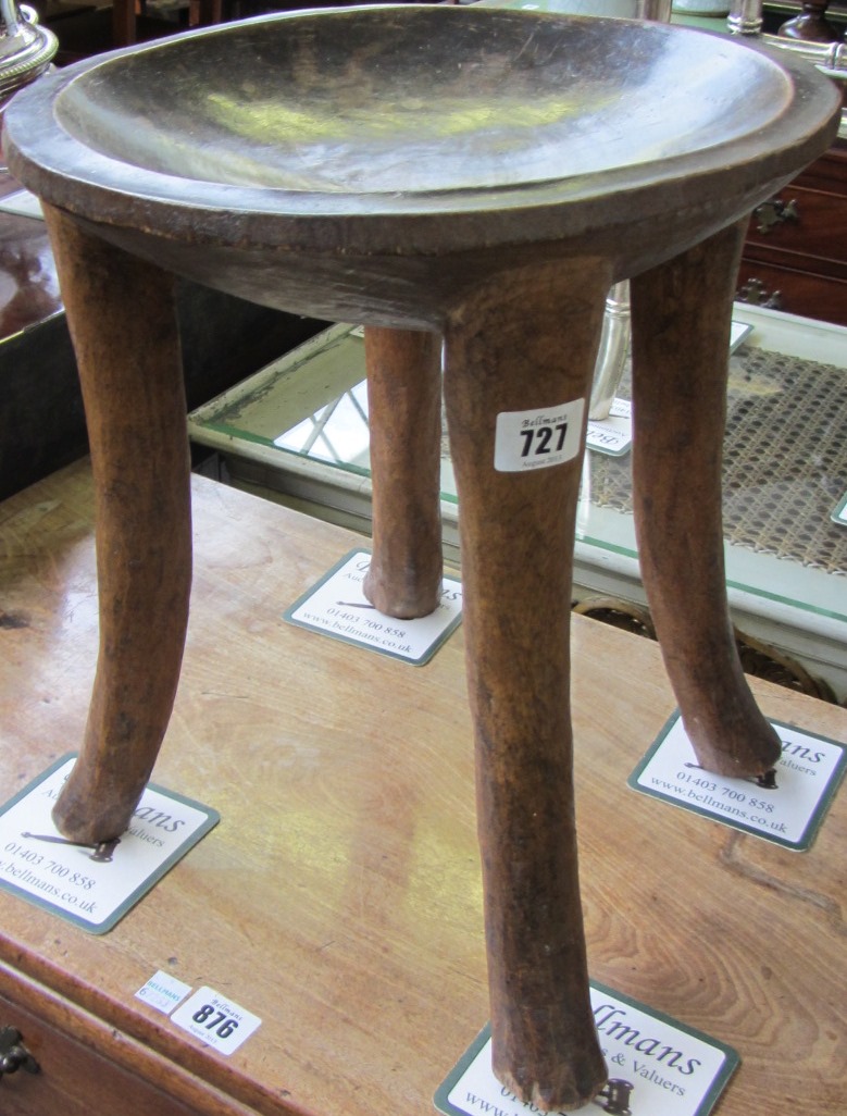 Appraisal: An early th century African carved hardwood stool with dished