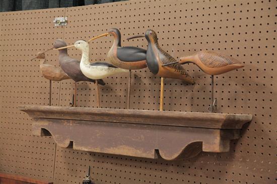 Appraisal: SIX WOODEN SHORE BIRDS AND A SHELF Carved wood and