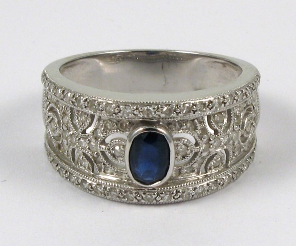 Appraisal: SAPPHIRE AND FOURTEEN KARAT GOLD RING The top half of