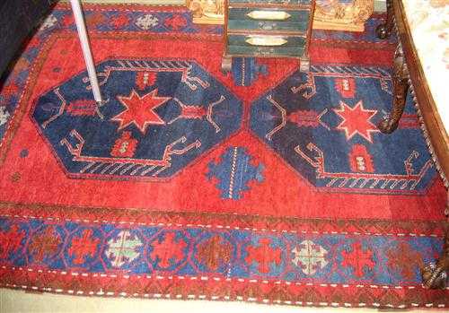 Appraisal: KAZAK old Red ground with two blue medallions geometrically patterned