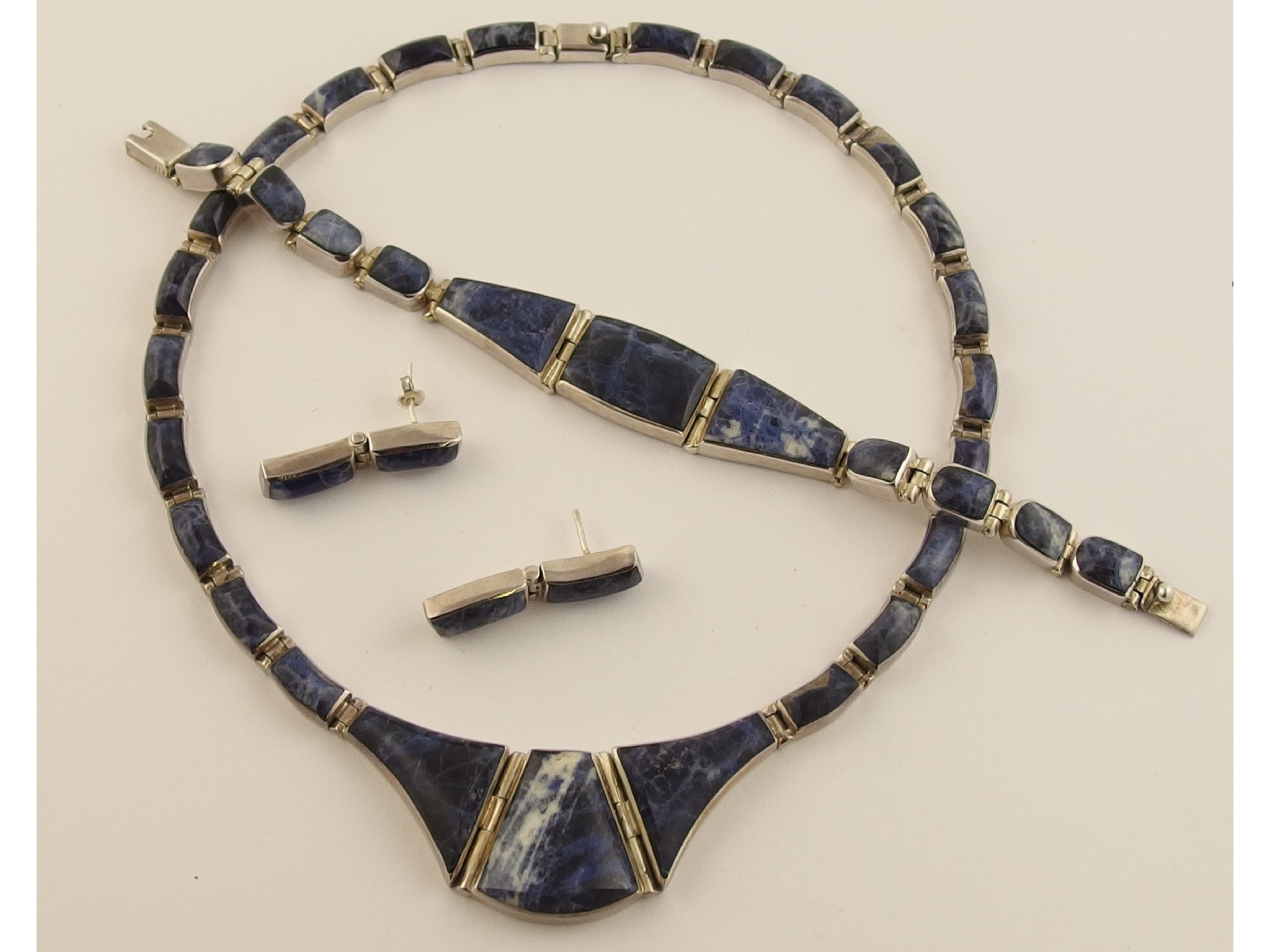 Appraisal: A silver and lapis lazuli necklace bracelet and earring set