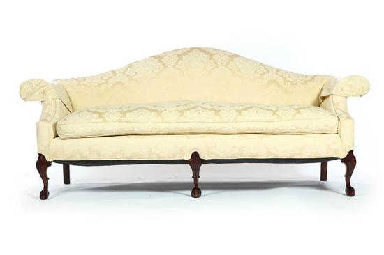 Appraisal: CHIPPENDALE-STYLE SOFA American late th century mahogany Camelback sofa with