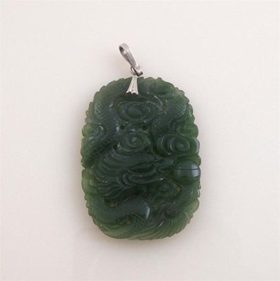 Appraisal: A pierced and carved jade pendant Gold mount