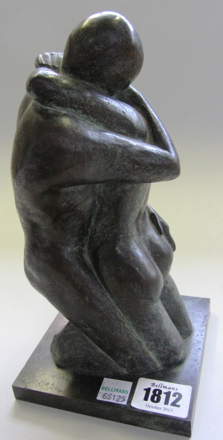 Appraisal: A contemporary patinated bronze sculpture modelled as an embracing couple