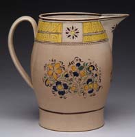 Appraisal: EARLY CREAMWARE SOFT PASTE PITCHER Pitcher has blue yellow and