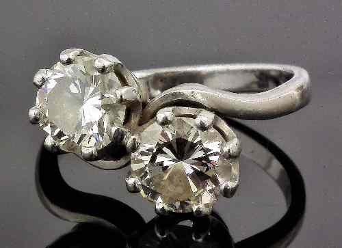 Appraisal: A s platinum mounted diamond crossover ring set with two