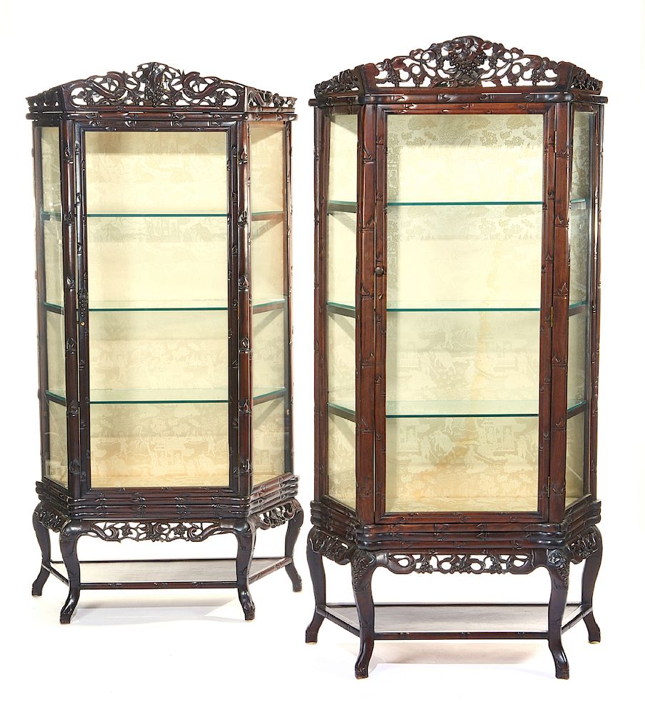 Appraisal: Pair of Chinese carved wood and glass display cabinets Pair