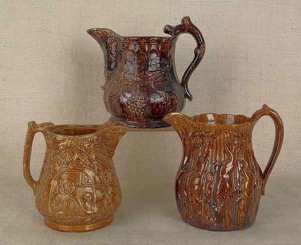 Appraisal: Three Rockingham glaze pitchers th c tallest -