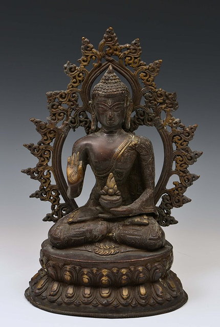 Appraisal: The McKelney CollectionA SINO-TIBETAN BRONZE KNEELING BUDDHA with hand raised