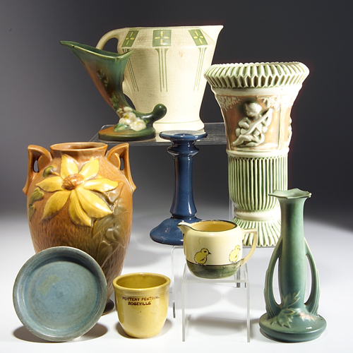 Appraisal: Nine ROSEVILLE pottery pieces to include a flaring Donatello vase